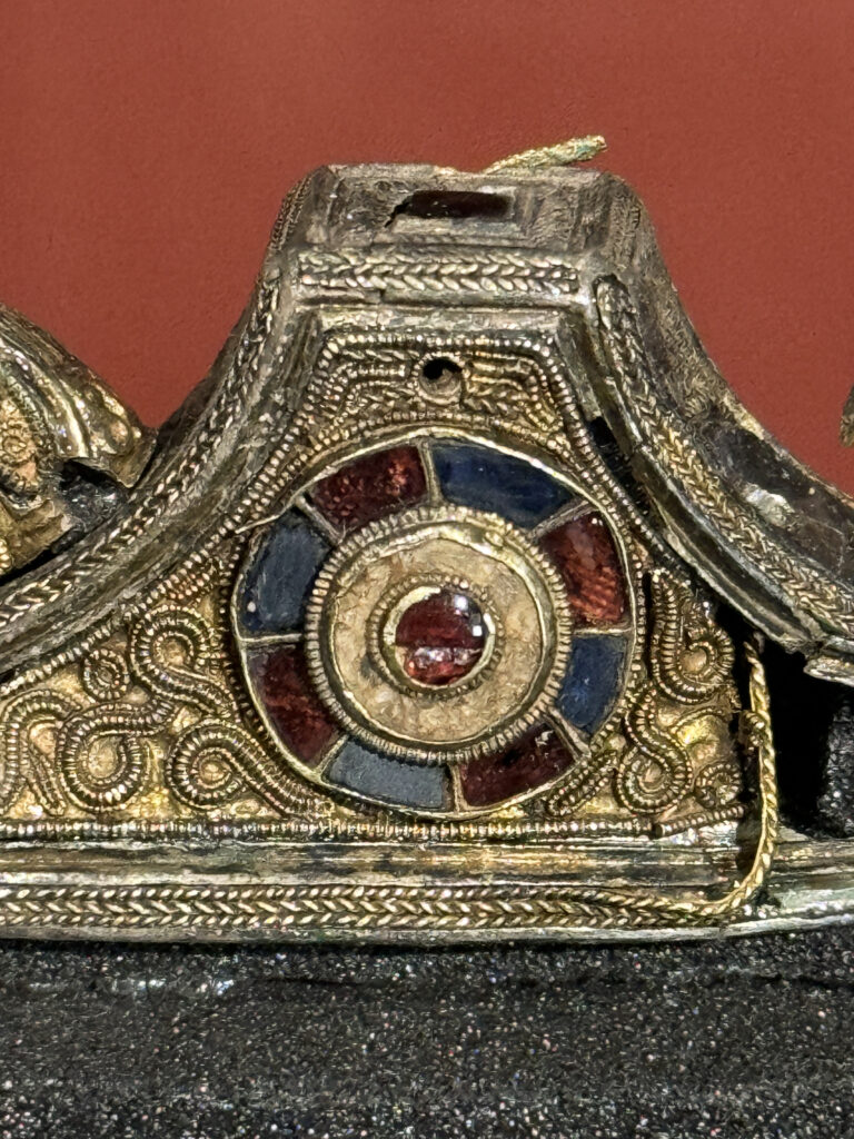 Pommel cap from the Staffordshire Hoard, featuring granulation with twisted and beaded wire, gold, garnet, glass